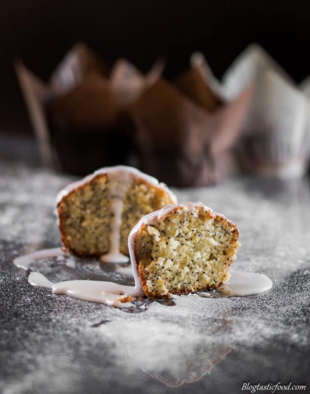 A photo of a lemon drizzle muffin that has been sliced in half.