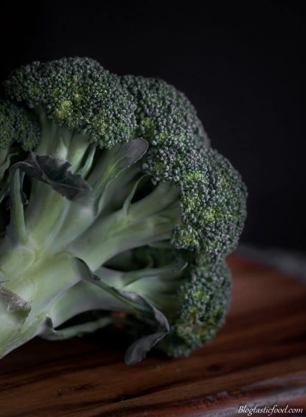 A close up, detailed dark moody photo of broccoli