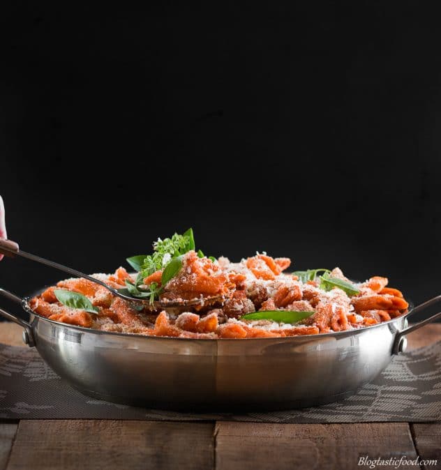 A big frying pan filled with hidden veggie sausage pasta. 