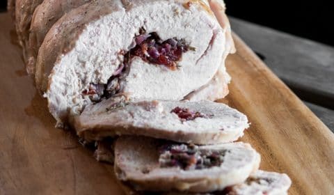 A photo of a cooked brined turkey roll that has been sliced.
