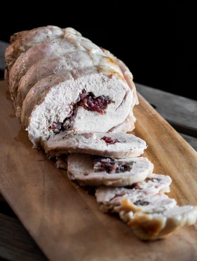 A photo of a cooked brined turkey roll that has been sliced.