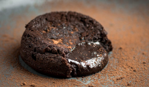 Molten oozing out of a chocolate lava cake.