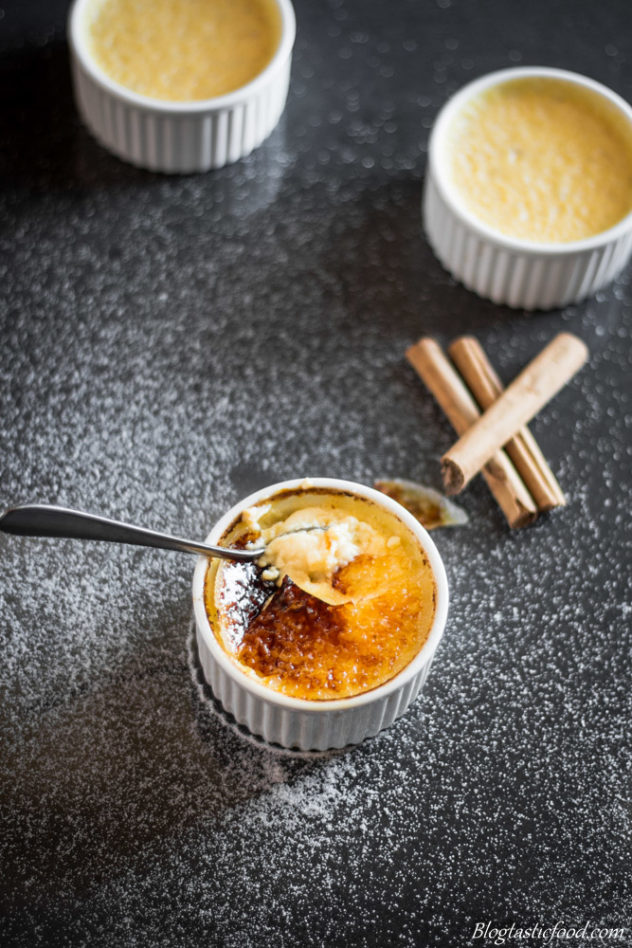 A spoon cracking into creme brulee. 