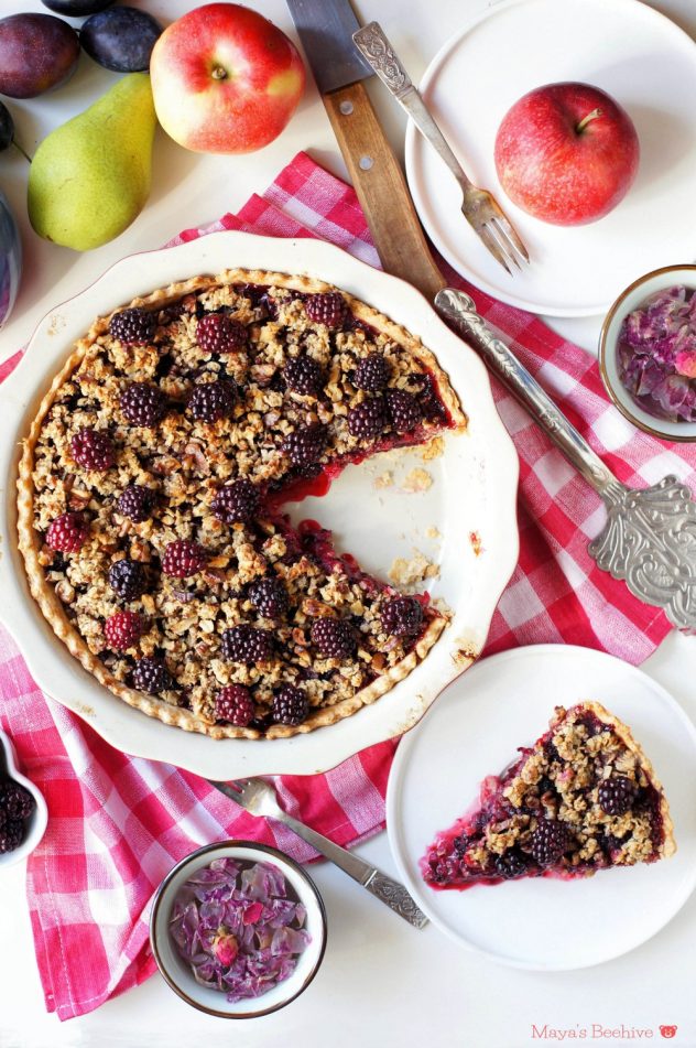 An overhead photo of blackberry pie topped with walnut crumble. 
