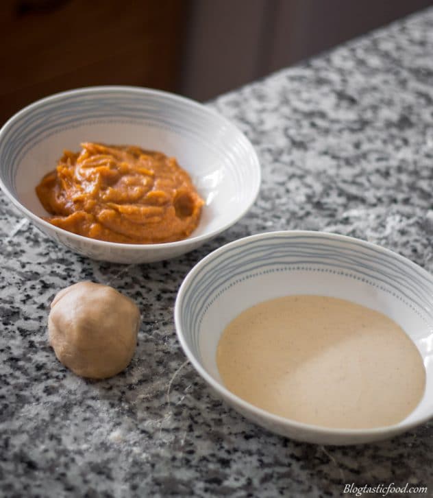 A photo of a bowl of creme anglaise, pumpkin puree and pasta dough.