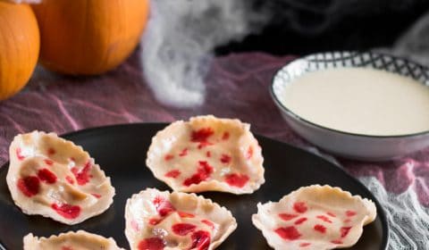 A photo of pumpkin raviolis with fake blood on them.
