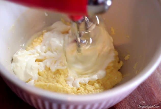 A photo of yogurt getting mixed through muffin batter. 