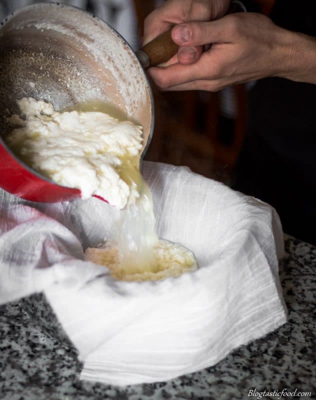 Ricotta cheese being strained using a
