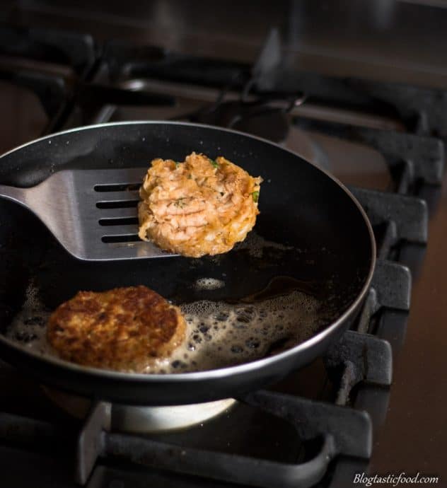 A photo of someone flipping a hash brown in a pan.