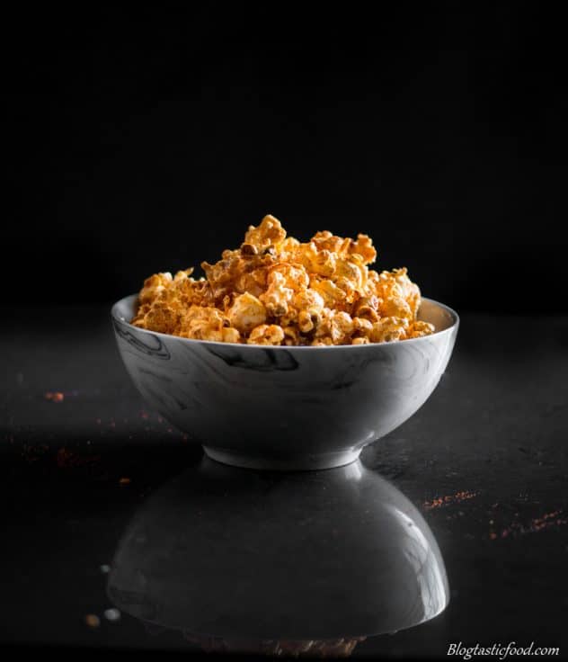 A eye lelel photo of spiced popcorn in a bowl.