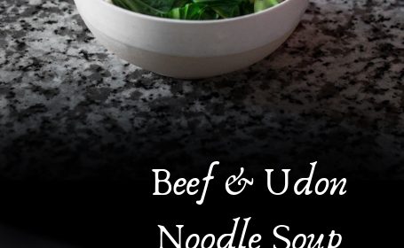 A beef and udon noodle soup recipe presented in the form of a pin.
