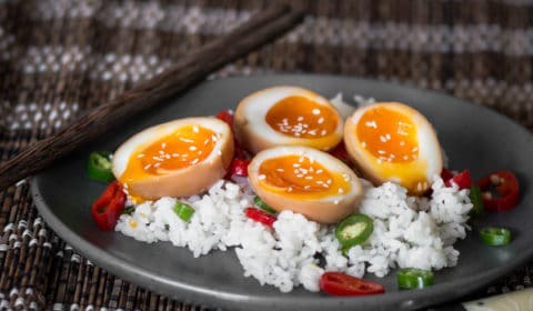 Soft boiled Ramen eggs served on a bed of sushi rice.