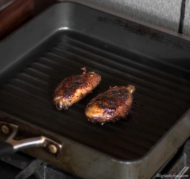 A photo of chicken wings being char-grilled.