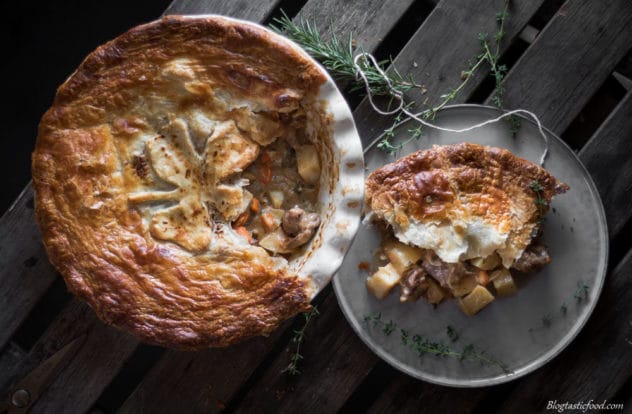 An overhead photo of a pie, with a portion of that pie on a plate beside it.