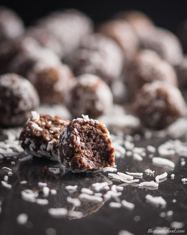 A photo of one protein cut in half with a bunch of other protein balls in the background.
