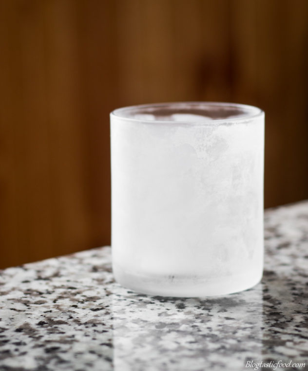 A chilled glass on a granit table.