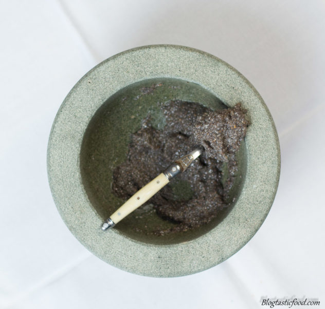 A vegan binder in the form of a gloopy chai mixture in a pestle mortar.