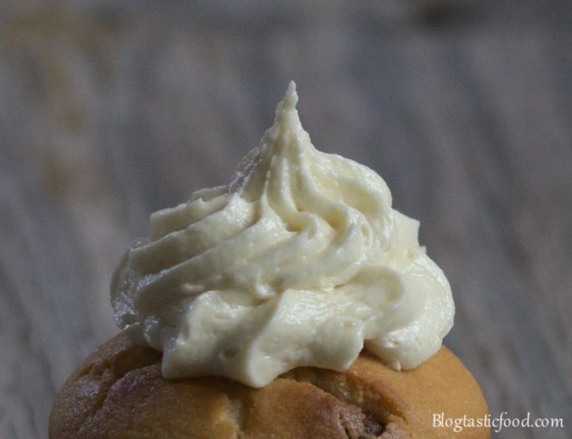 A close up of banana flavoured butter cream on a muffin.