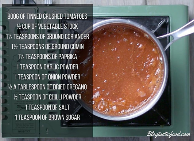 Enchilada sauce simmering in a pot, with a list of ingredients for the sauce beisde it. 
